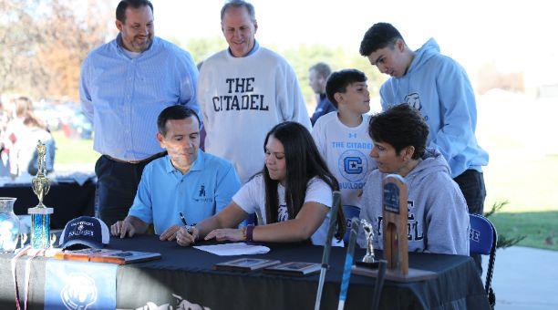 Student signing letter of intent for the Citadel