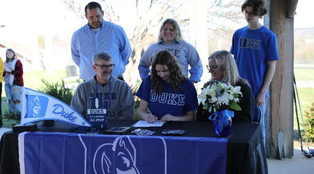 Student signing letter of intent for Duke