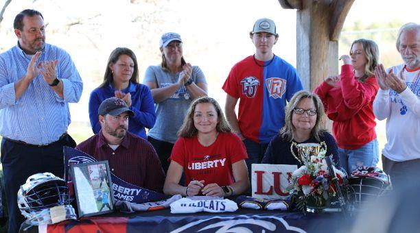 Student signing letter of intent for Liberty