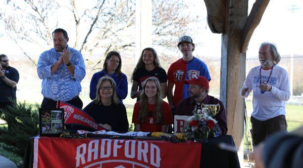 Student signing letter of intent for Radford