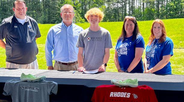 Evan signing with Rhodes